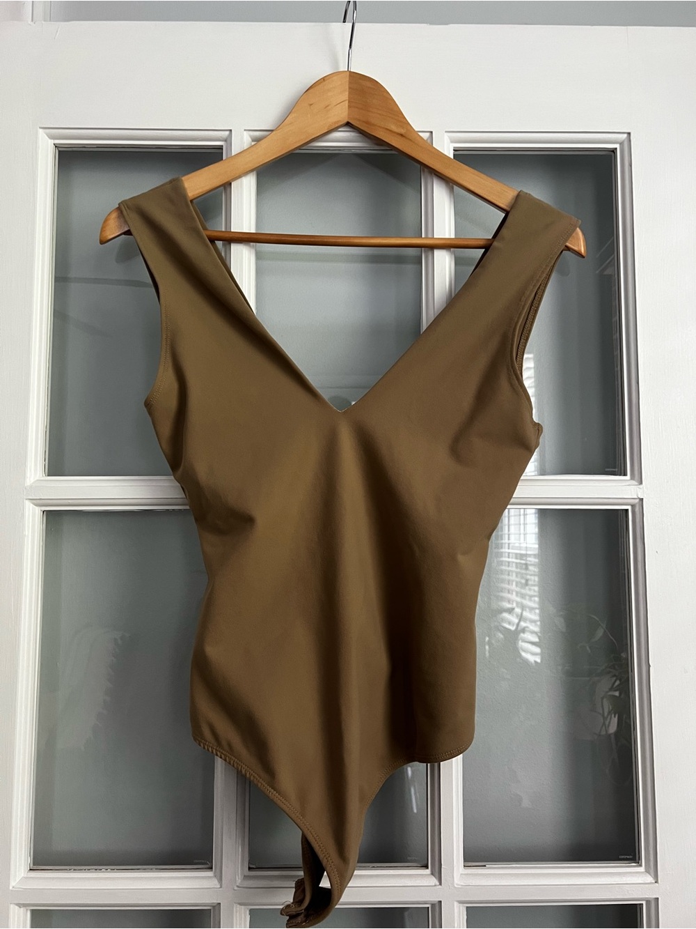 Sleeveless Tan V-Neck Asymmetric Bodysuit - Picture 1 of 7